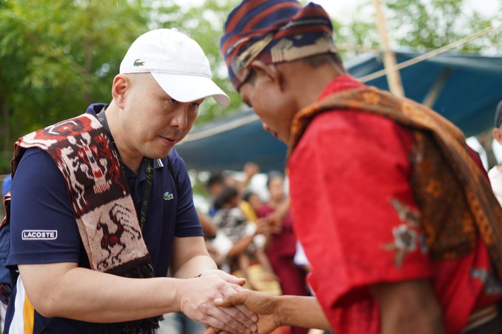 Local People in Sumba Island Welcoming Guest with Traditional Tenun (Woven Cloth)