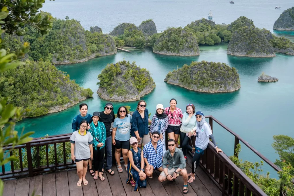 Tourist Visiting and Taking Photo at Piaynemo, Raja Ampat