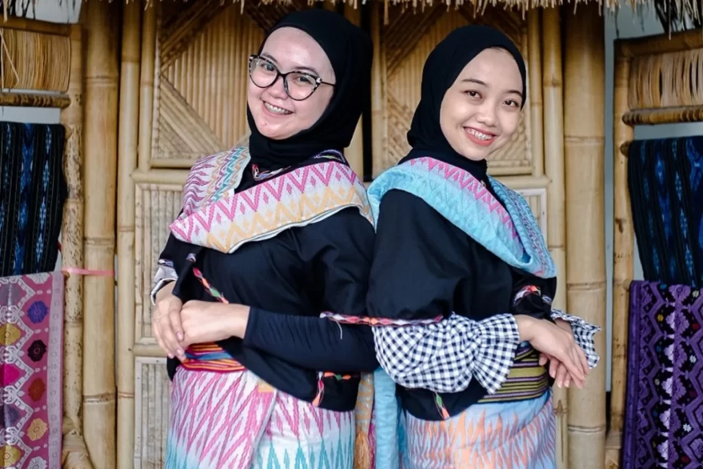 wearing traditional weaving textile in lombok