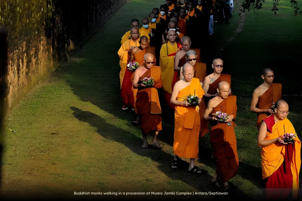 Buddhist monks walking in a procession at Muaro Jambi Complex